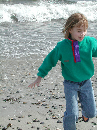 Laura plays with the waves