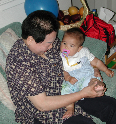 Kim-fai inspects Maya's leg