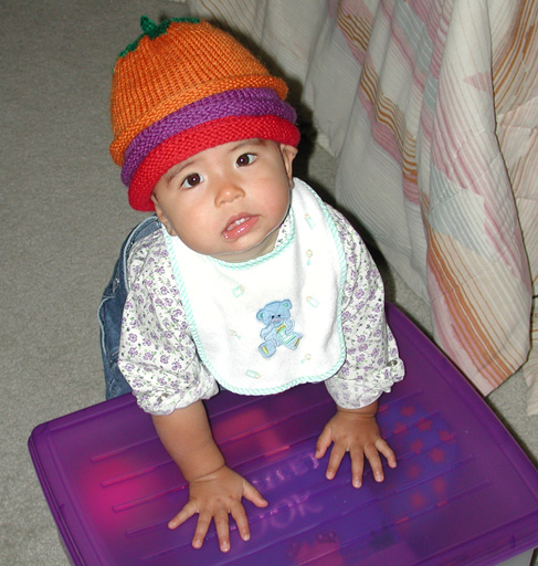 Maya shows off the hats from Cathy