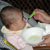 Maya eats her first real semi-solid food