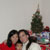 Rebecca, Maya, and Mark by the Christmas tree