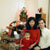 Rebecca, Maya, and Mark by the Christmas tree