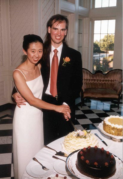 Rebecca and Mark cutting the cake